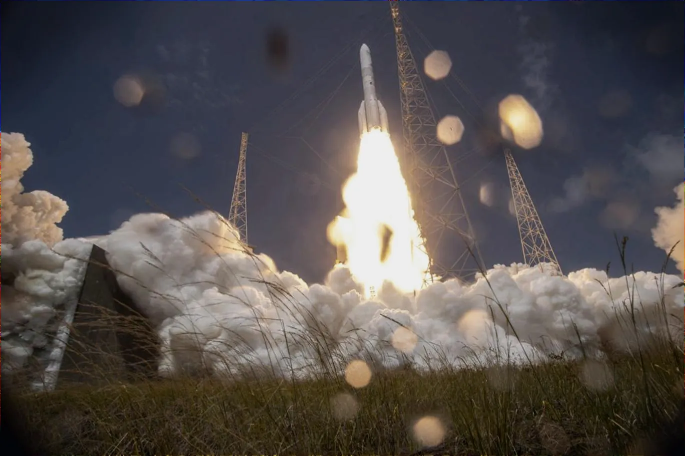 A rocket standing in a field